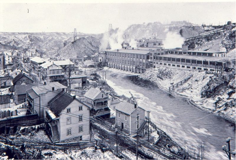 The Belgo pulp and paper mill along the shores of the Shawinigan River. Workers' homes are clearly visible.