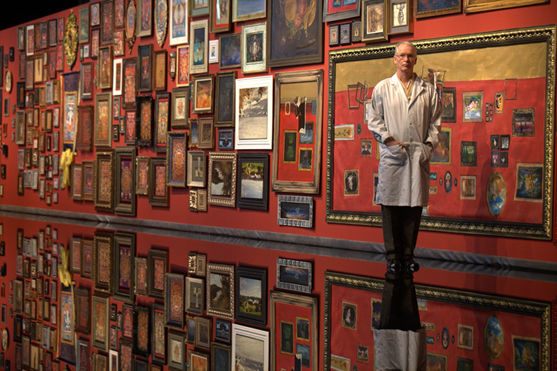 Richard Purdy poses proudly  in front of the L'écho-l'eau Exhibit (water echo exhibit)