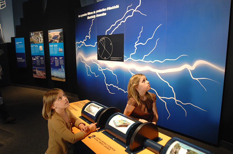 Two young girls exploring The Ages of Energy exhibit